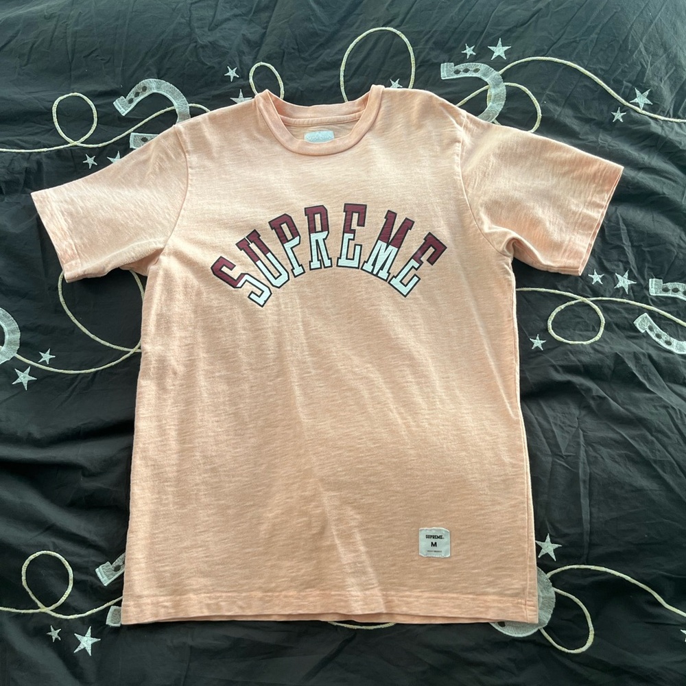 Supreme curve logo tee spellout in light orange